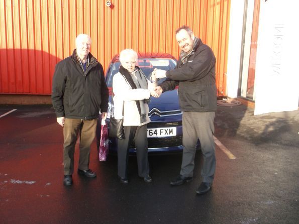 Miss Myrtle collecting her new car from Citroen Bury