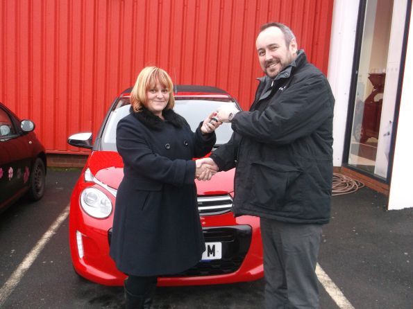 Miss Stewart collecting her new C1 from Lee Anslow at Citroen Bury