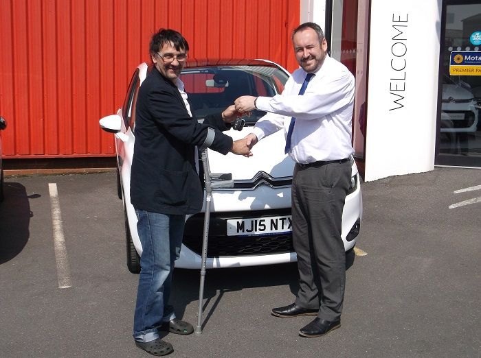 Mr Laight collecting his brand new Citroen C4 Picasso from Lee Anslow at Citroen Bury.